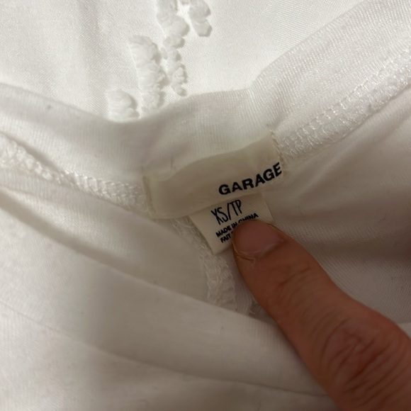 Garage white tank top with exposed back and graphic winking eye detail - Picture 2 of 4